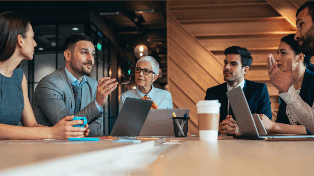 board members around a board meeting table
