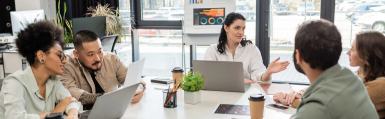 Colleagues working alongside each other in an office table